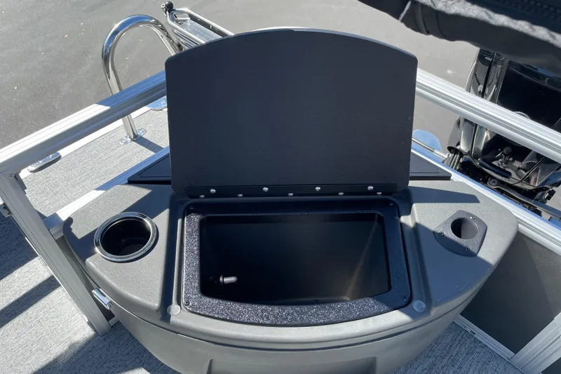 Slide: The Image of Open storage compartment on 2026 Sun Tracker Bass Buggy 18 DLX pontoon boat. - 27