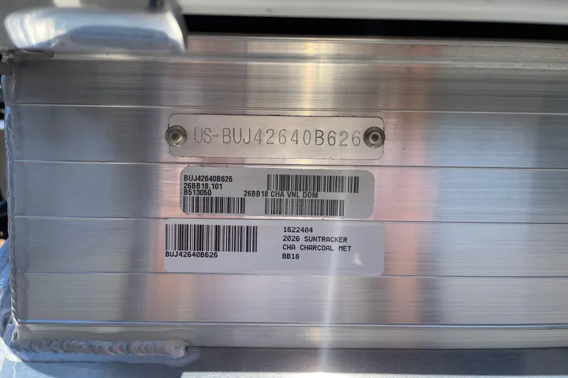 Slide: The Image of 2026 Sun Tracker Bass Buggy 18 DLX identification plate with serial numbers and barcodes. - 116