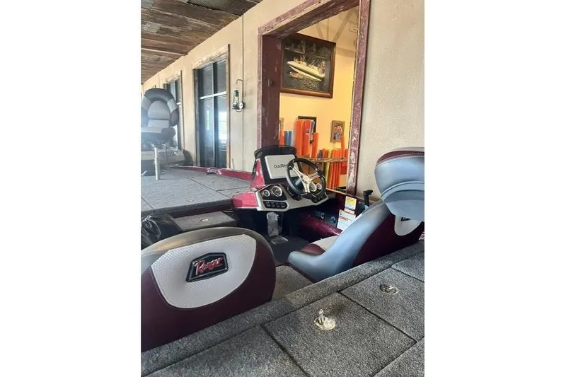 Slide: The Image of 2026 Ranger Z185 boat interior with Garmin navigation system and comfortable seating. - 9