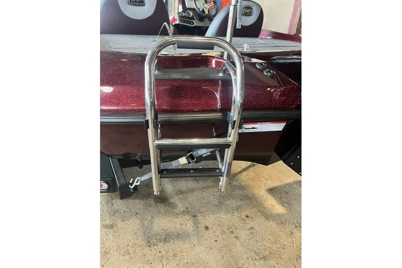 Slide: The Image of 2026 Ranger Z185 boat with a shiny metallic ladder and maroon finish. - 6