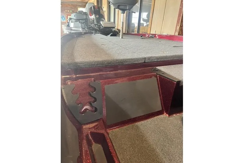Slide: The Image of 2026 Ranger Z185 boat interior with carpeted deck and seating. - 4