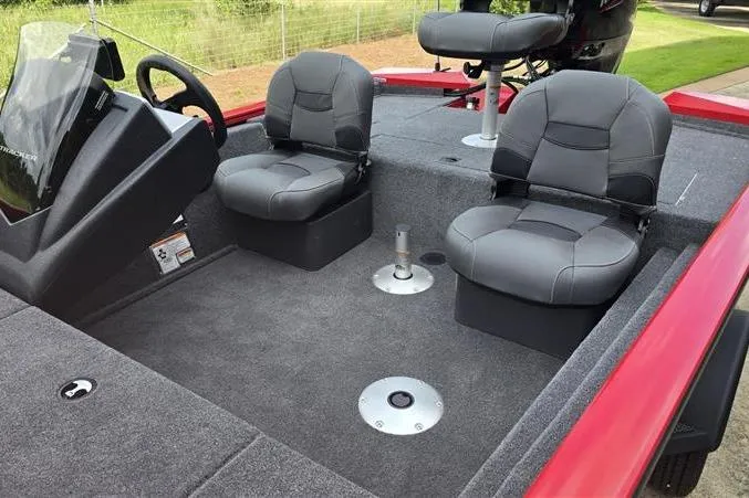 Slide: The Image of 2026 Tracker Pro Team 175 Crappie Edition boat interior with gray seating and steering console. - 10