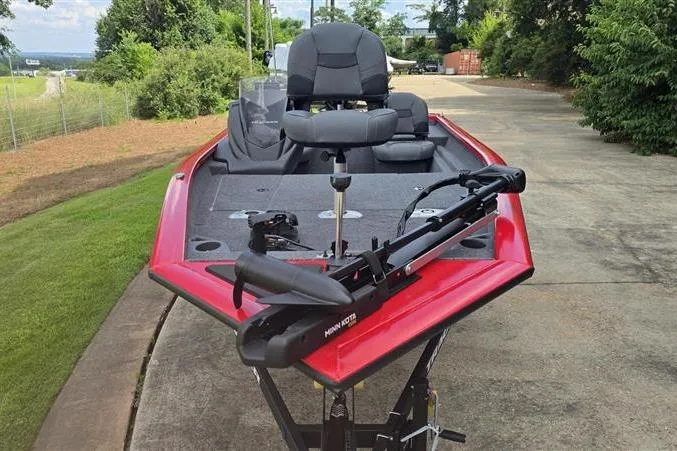Slide: The Image of 2026 Tracker Pro Team 175 Crappie Edition boat with red exterior on a driveway. - 5