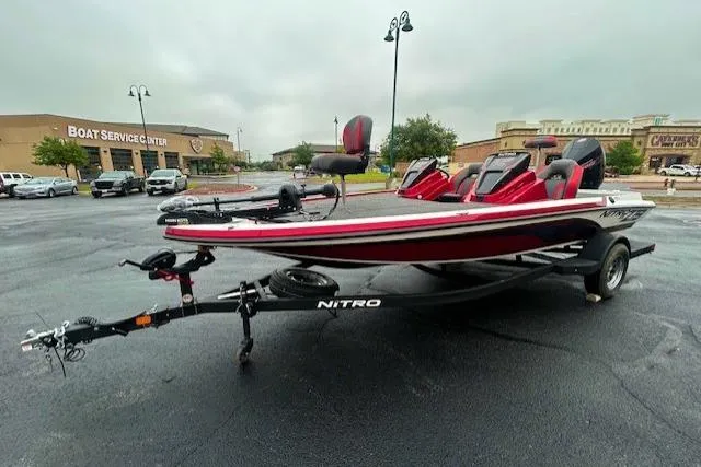 The Image of 2026 Nitro Z19 XL boat on trailer in parking lot near service center. - 0