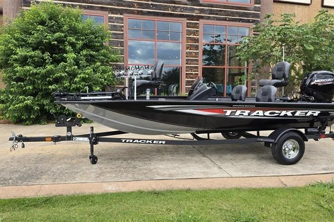 The Image of 2026 Tracker Pro Team 175 Crappie Edition boat on trailer, parked outdoors. - 0