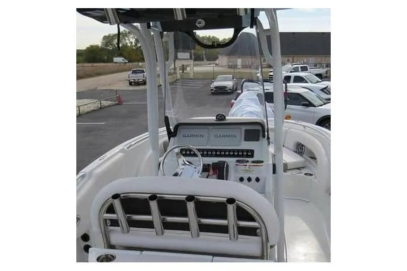 Slide: The Image of 2024 Finseeker 230 CC boat interior with Garmin navigation system, parked in a lot. - 11