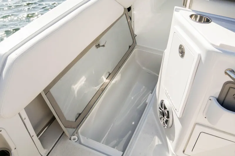 Slide: The Image of 2024 Finseeker 230 CC boat interior storage compartment and seating area. - 17