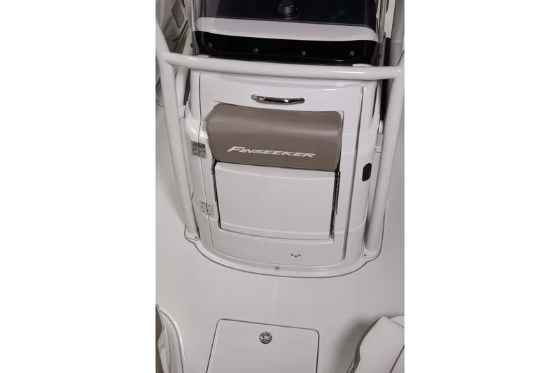 Slide: The Image of 2024 Finseeker 230 CC boat console with storage compartment and sleek design. - 19