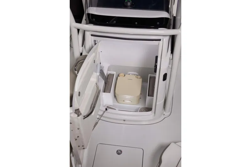 Slide: The Image of 2024 Finseeker 230 CC boat interior storage compartment with portable toilet. - 20