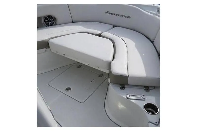 Slide: The Image of 2024 Finseeker 230 CC boat interior with cushioned seating and storage compartments. - 22
