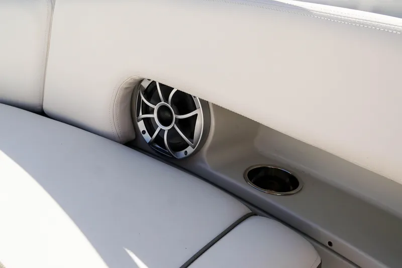 Slide: The Image of 2024 Finseeker 230 CC boat interior with speaker and cup holder. - 23