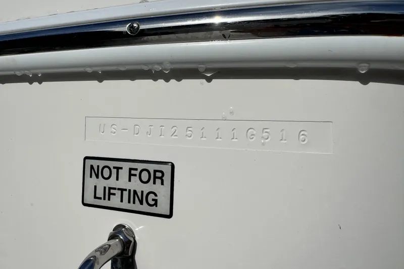Slide: The Image of 2016 Regulator 25 boat hull identification number with "Not for Lifting" warning label. - 15