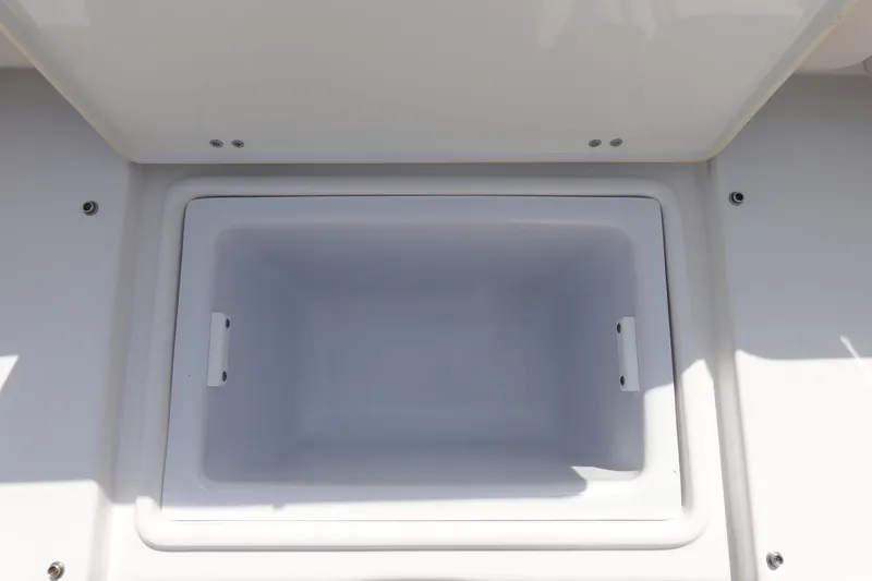 Slide: The Image of Open storage compartment on 2023 Sea Hunt Escape 28 boat. - 10