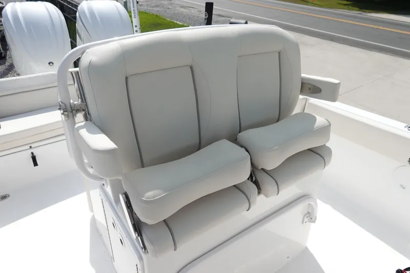 Slide: The Image of 2023 Sea Hunt Escape 28 boat with dual cushioned seats and armrests. - 15