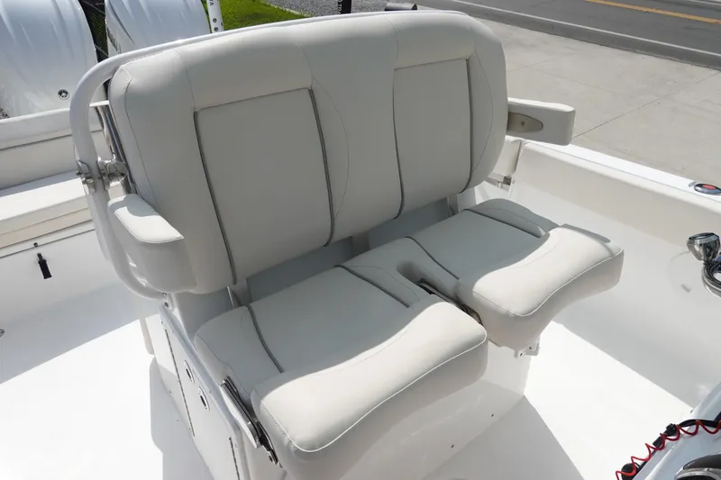 Slide: The Image of 2023 Sea Hunt Escape 28 boat seating, featuring comfortable dual captain's chairs. - 16