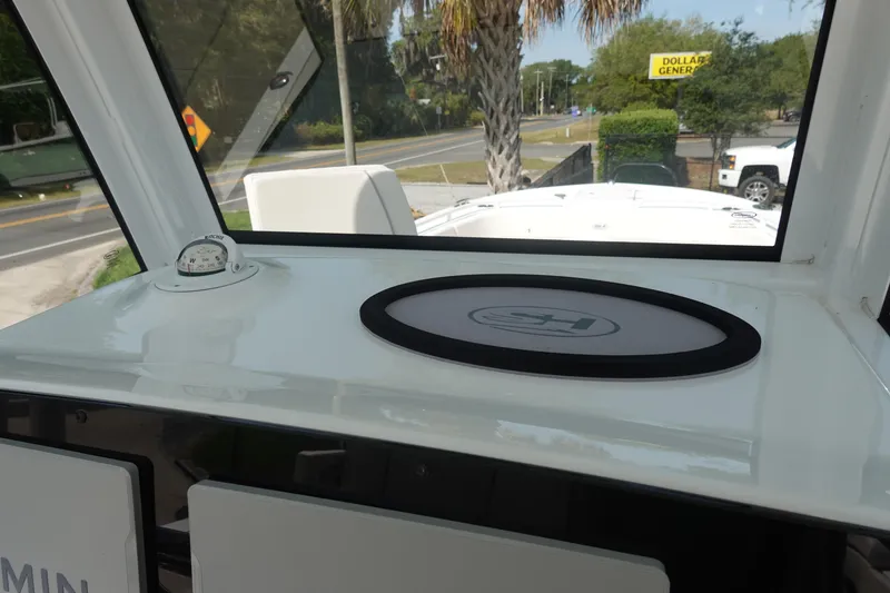 Slide: The Image of 2023 Sea Hunt Escape 28 boat interior with compass and dashboard view. - 21