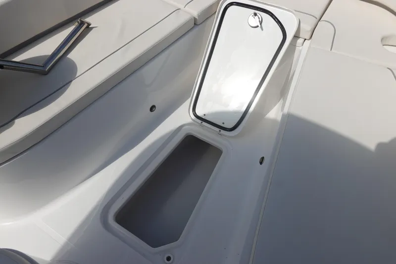 Slide: The Image of Open storage compartment on 2023 Sea Hunt Escape 28 boat deck. - 27