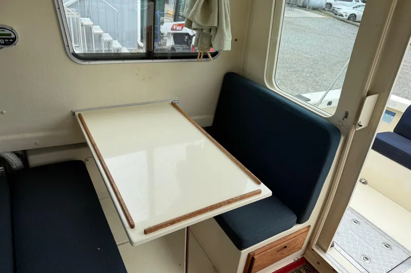 Slide: The Image of 2008 Rosborough RF-246 Sedan Cruiser interior with table and seating area. - 10
