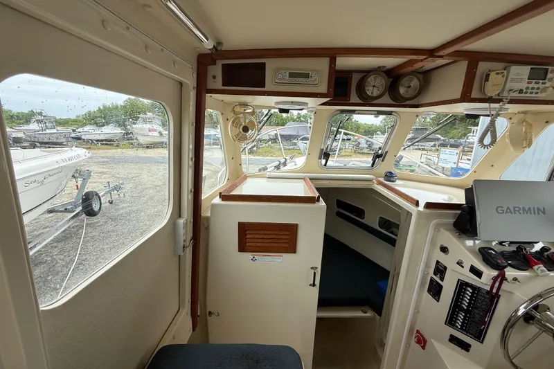 Slide: The Image of Interior of 2008 Rosborough RF-246 Sedan Cruiser with navigation equipment and control panel. - 15