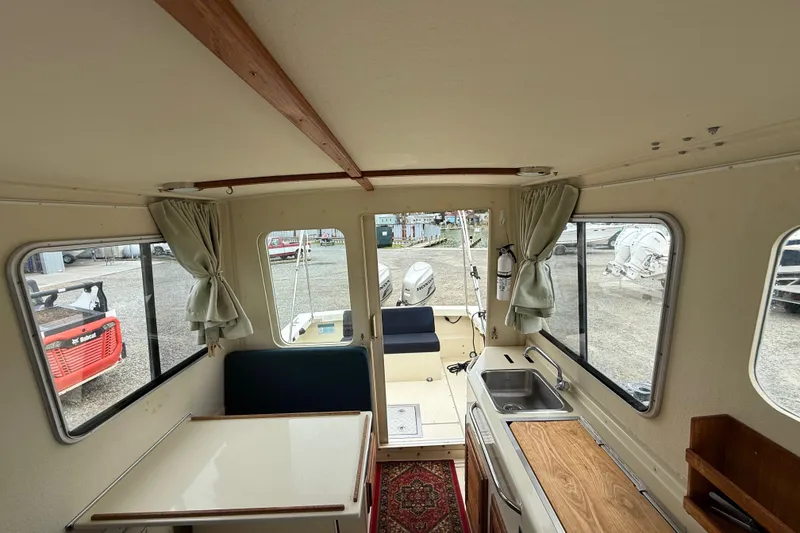 Slide: The Image of Interior of 2008 Rosborough RF-246 Sedan Cruiser with kitchenette and seating area. - 16