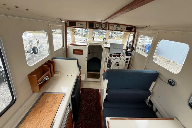 Slide: The Image of Interior of 2008 Rosborough RF-246 Sedan Cruiser with helm, seating, and navigation equipment. - 17