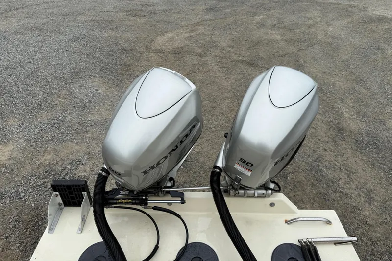 Slide: The Image of Twin Honda outboard motors on a 2008 Rosborough RF-246 Sedan Cruiser. - 20