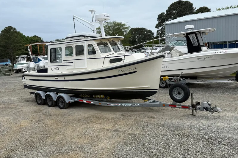 Slide: The Image of 2008 Rosborough RF-246 Sedan Cruiser on trailer in a boatyard. - 8