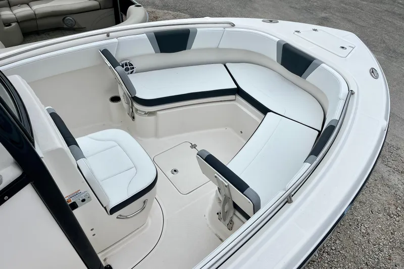 Slide: The Image of 2024 Robalo R230 Center Console boat with spacious seating and sleek design. - 13