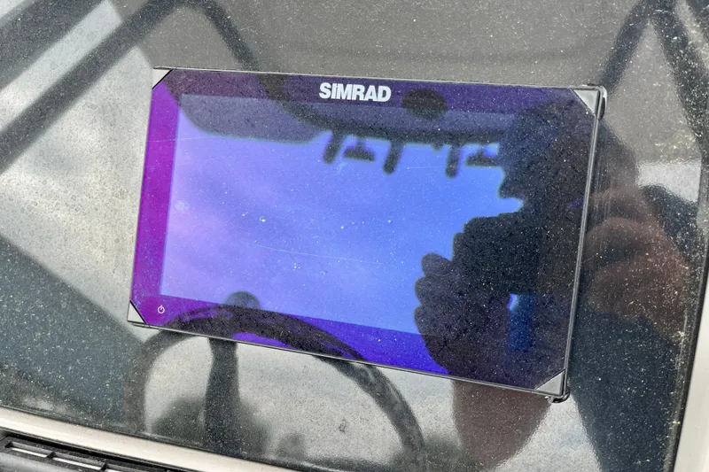 Slide: The Image of Simrad display on 2024 Robalo R230 Center Console boat dashboard. - 20