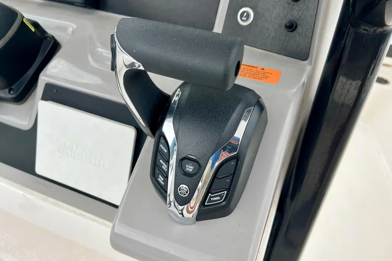 Slide: The Image of Throttle control of 2024 Robalo R230 Center Console boat with Yamaha branding. - 21