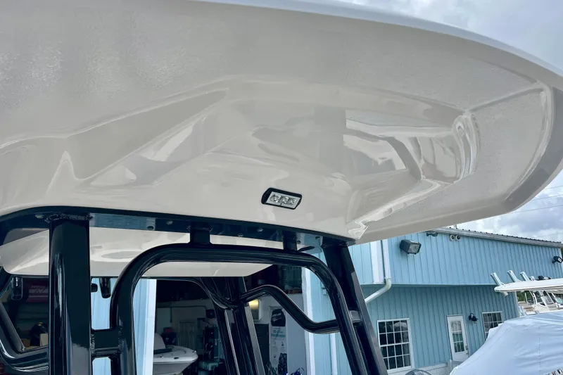 Slide: The Image of 2025 Robalo R230 Center Console with T-top design. - 24