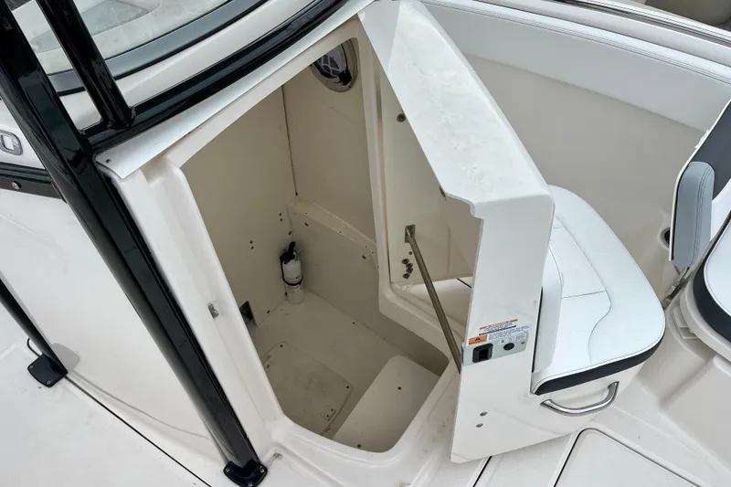 Slide: The Image of 2024 Robalo R230 Center Console boat interior storage compartment. - 28