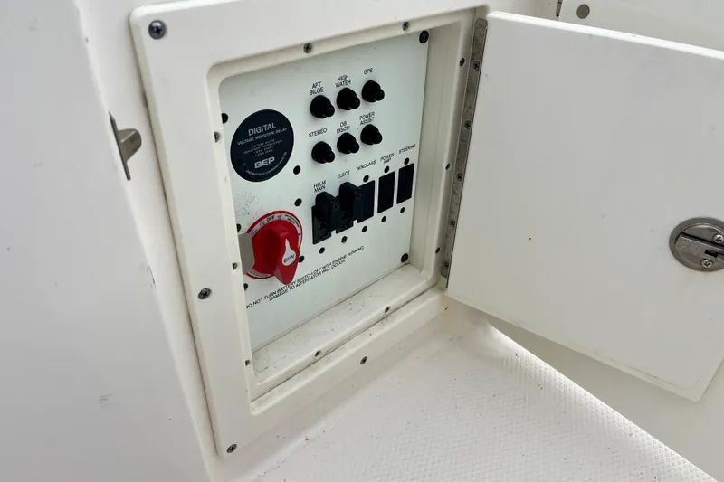Slide: The Image of Control panel of 2024 Robalo R230 Center Console boat with switches and digital display. - 33