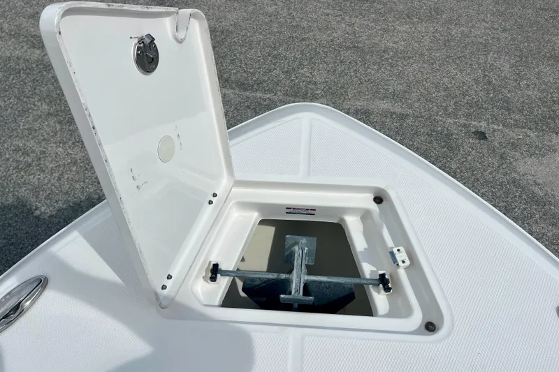 Slide: The Image of 2025 Robalo R230 Center Console anchor compartment open. - 35