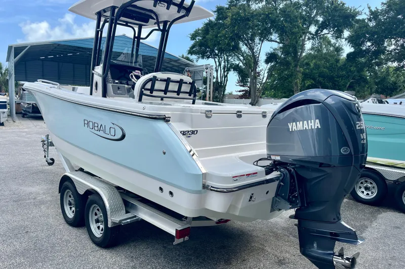 Slide: The Image of 2025 Robalo R230 Center Console with Yamaha engine on trailer. - 4