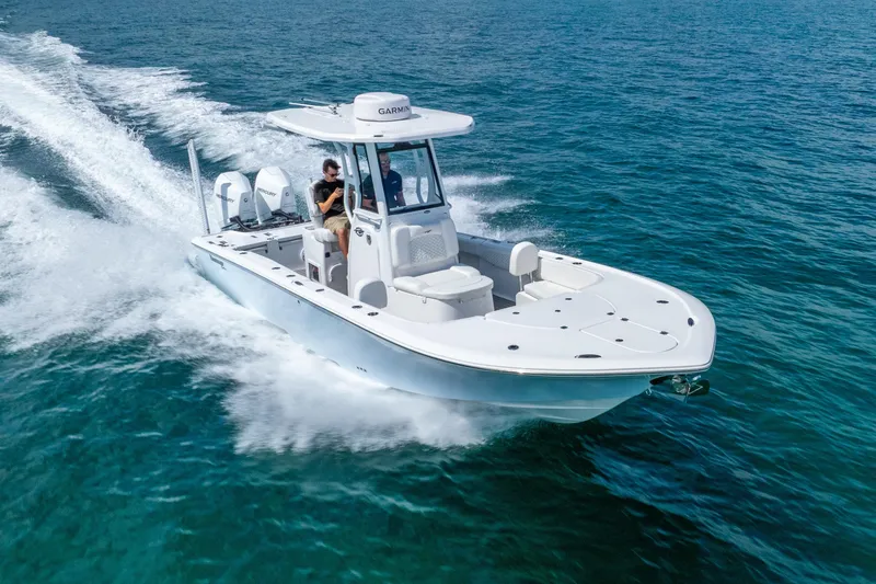Slide: The Image of 2026 Tidewater 2700 Carolina Bay boat cruising on open water. - 13
