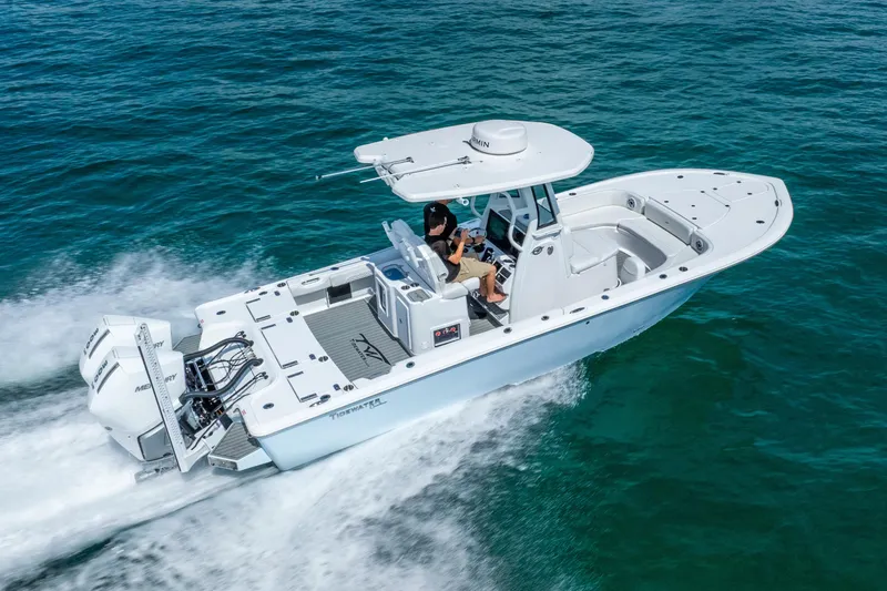 Slide: The Image of 2026 Tidewater 2700 Carolina Bay boat cruising on open water. - 14