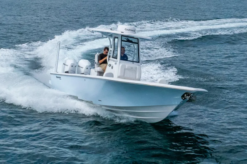 Slide: The Image of 2026 Tidewater 2700 Carolina Bay boat cruising on open water. - 21
