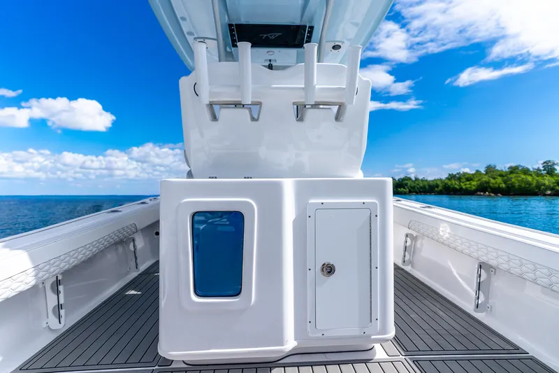 Slide: The Image of 2026 Tidewater 2700 Carolina Bay boat interior with rod holders, ocean view, and clear sky. - 37