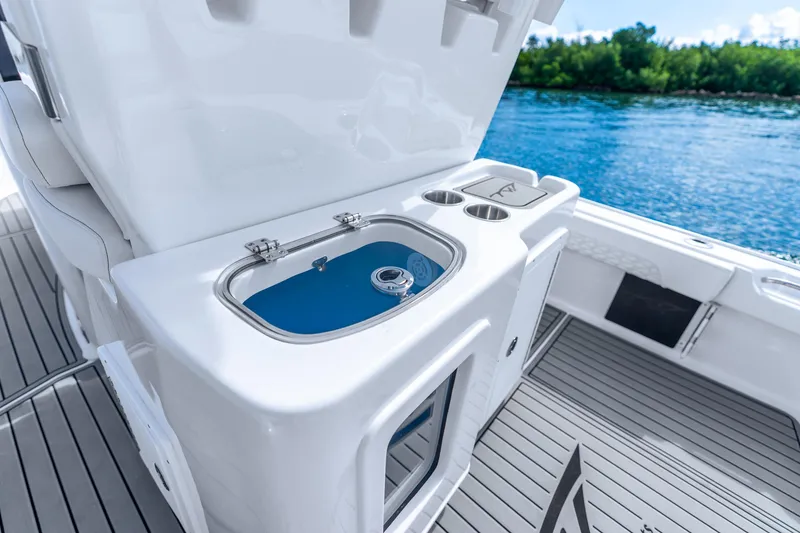 Slide: The Image of 2026 Tidewater 2700 Carolina Bay boat interior with livewell and cup holders. - 41