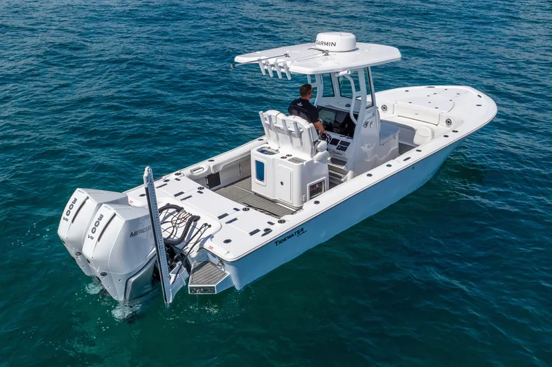 Slide: The Image of 2026 Tidewater 2700 Carolina Bay boat cruising on clear blue water. - 8