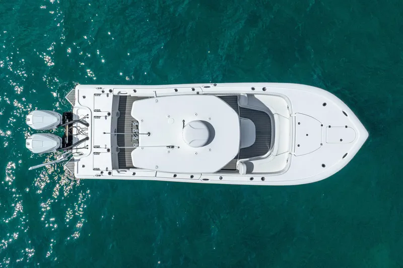 Slide: The Image of Aerial view of 2026 Tidewater 2700 Carolina Bay boat on clear blue water. - 9