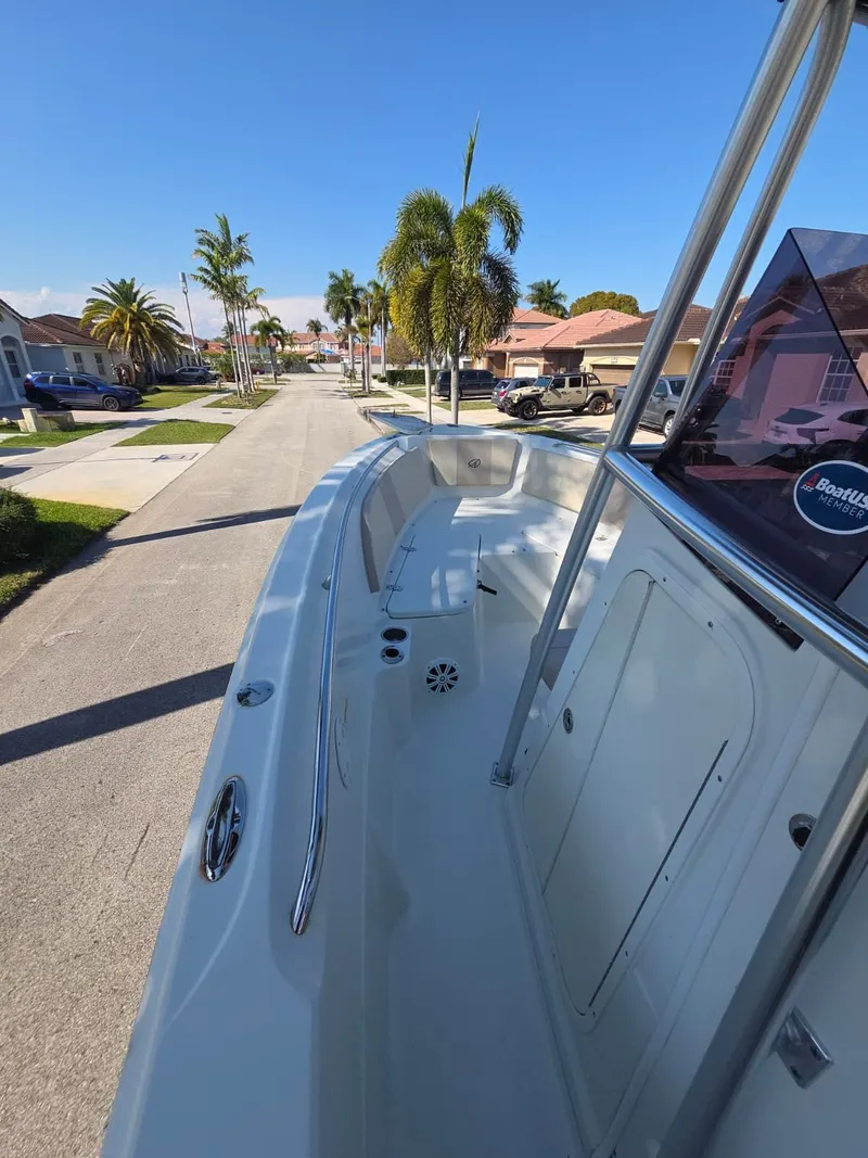 Slide: The Image of 2007 Sailfish 218 CC boat parked on a sunny street. - 14
