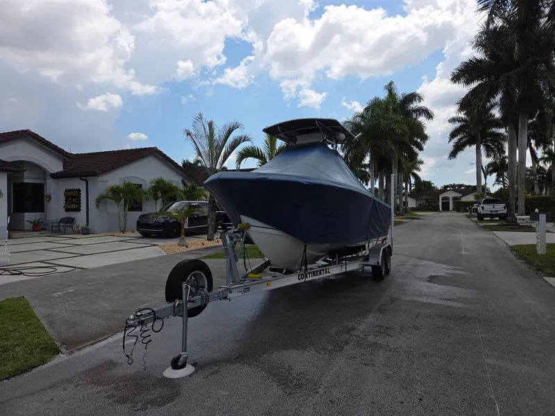 Slide: The Image of 2007 Sailfish 218 CC boat on trailer in residential area. - 4