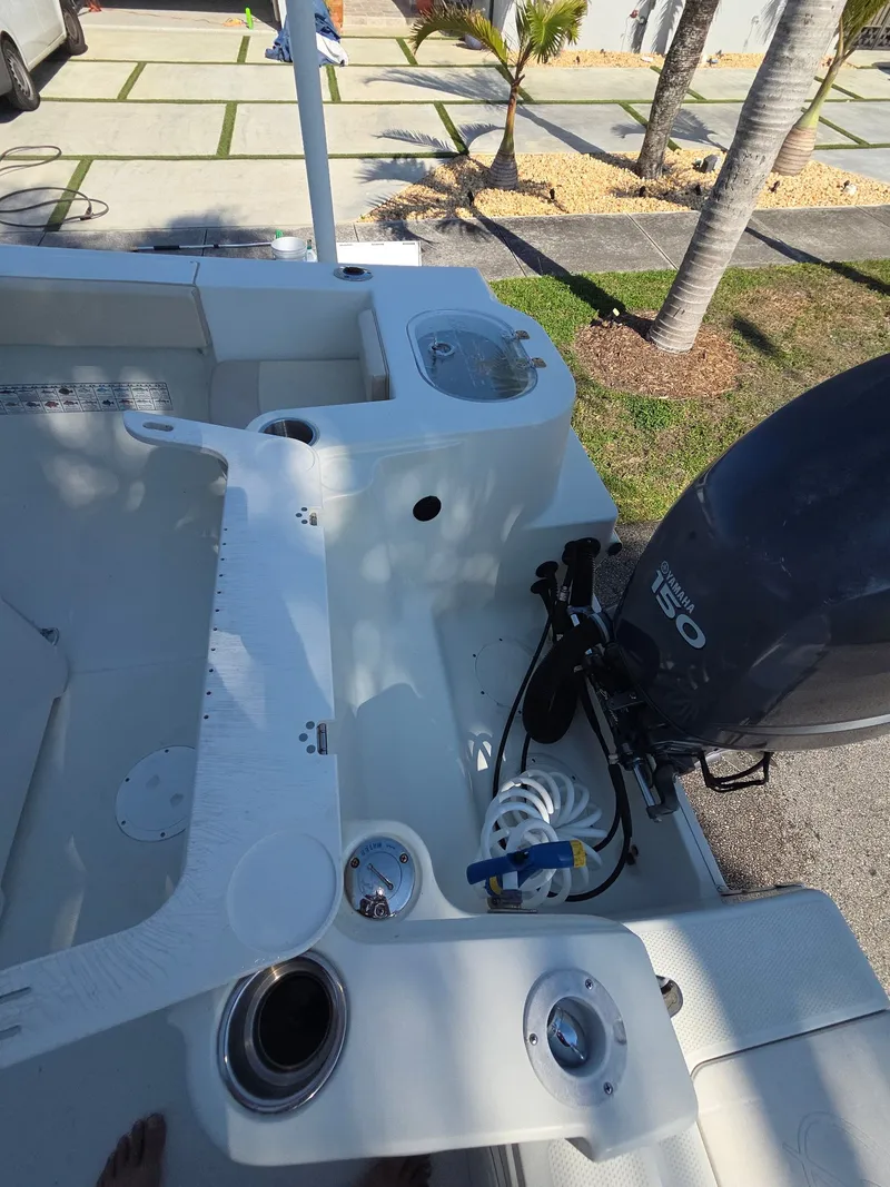 Slide: The Image of Interior view of a 2007 Sailfish 218 CC boat with outboard motor. - 8