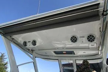 Slide: The Image of 2024 Crownline 310 CRX boat interior with speakers and modern design. - 15