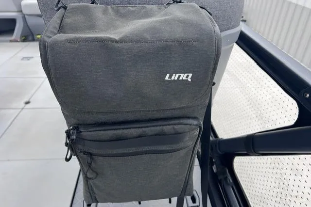Slide: The Image of 2022 Seadoo Switch LinQ storage bag on boat seat, showcasing practical design. - 10