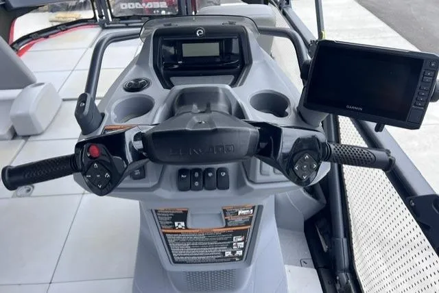 Slide: The Image of 2022 Seadoo Switch dashboard with steering controls and Garmin display. - 11