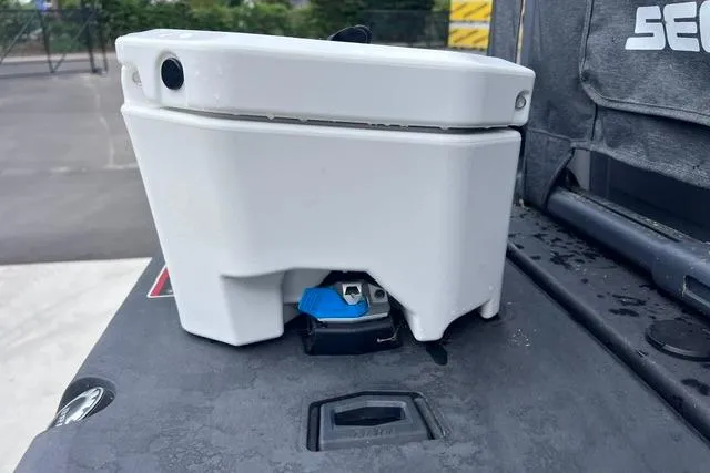 Slide: The Image of 2022 Seadoo Switch component detail on deck, showcasing a white housing and blue connector. - 20