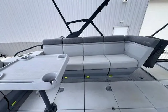 Slide: The Image of 2022 Seadoo Switch interior with gray seating and table, showcasing modern design. - 5